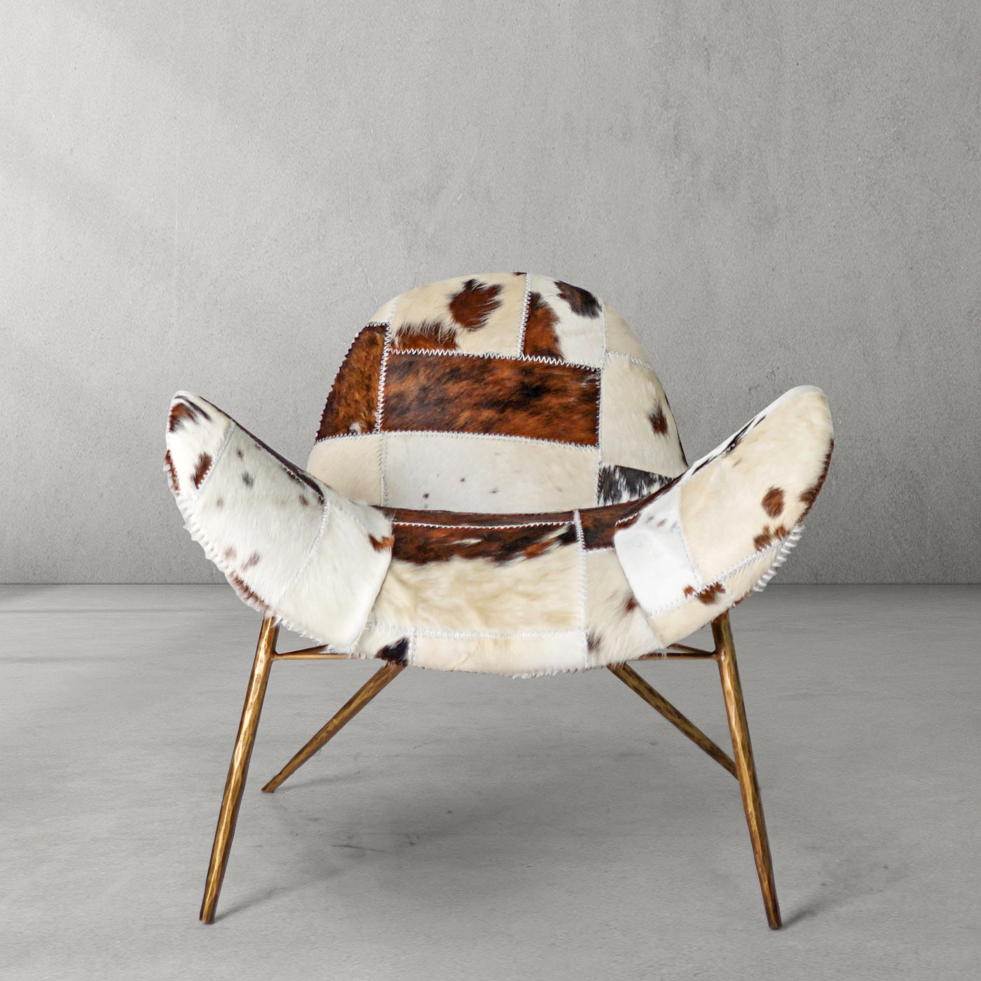 Cowhide Patchwork Wing Chair with Brass Base