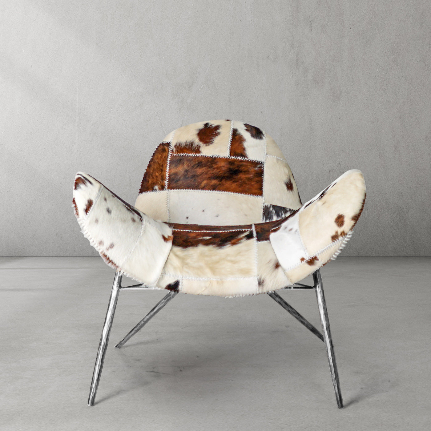 Cowhide Patchwork Wing Chair with Pewter Base