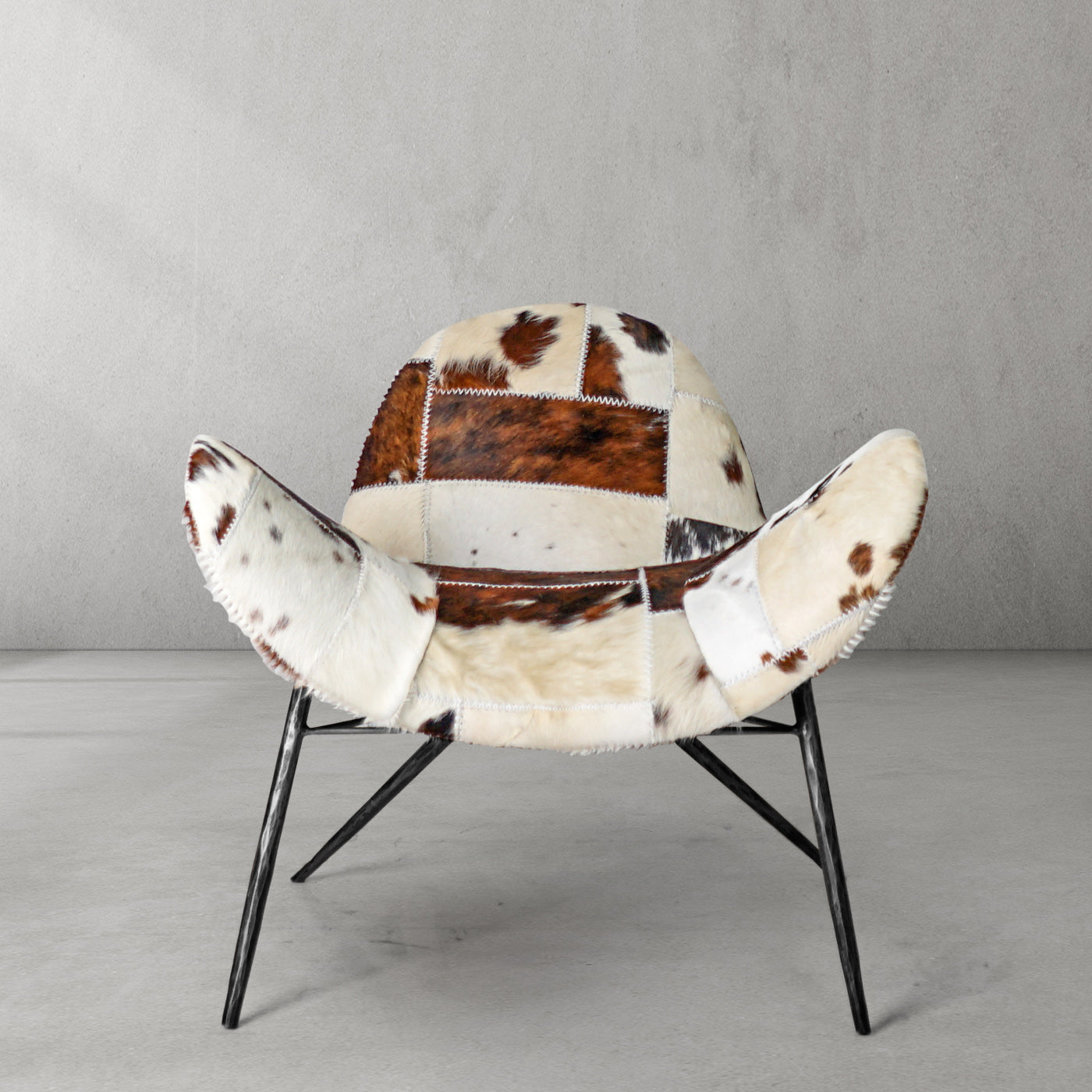 Cowhide Patchwork Wing Chair with Bronze Base