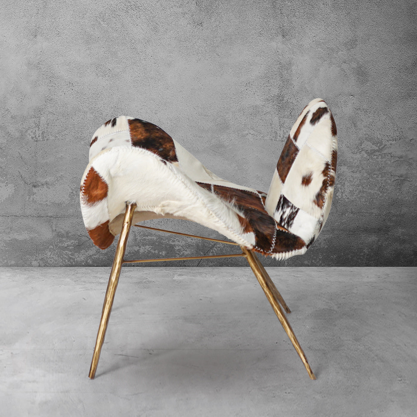 Cowhide Patchwork Wing Chair with Brass Base