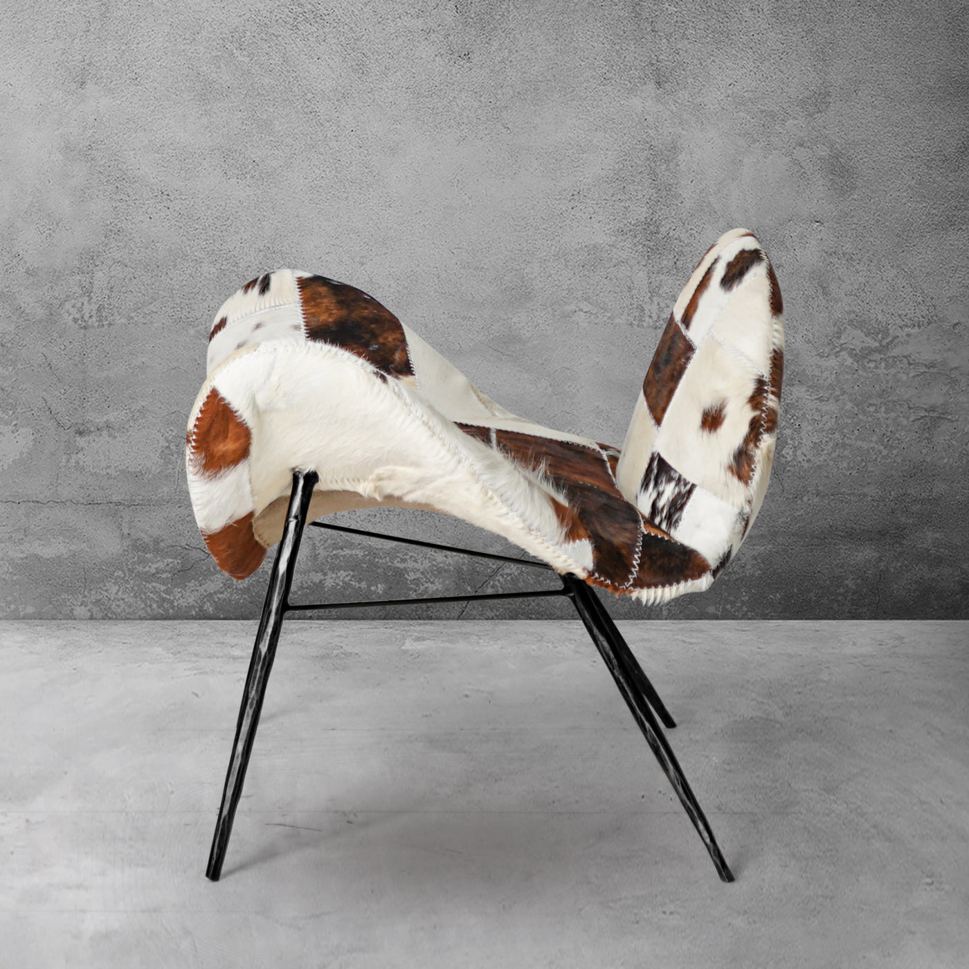 Cowhide Patchwork Wing Chair with Bronze Base