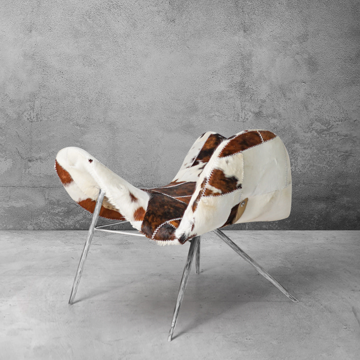 Cowhide Patchwork Wing Chair with Pewter Base